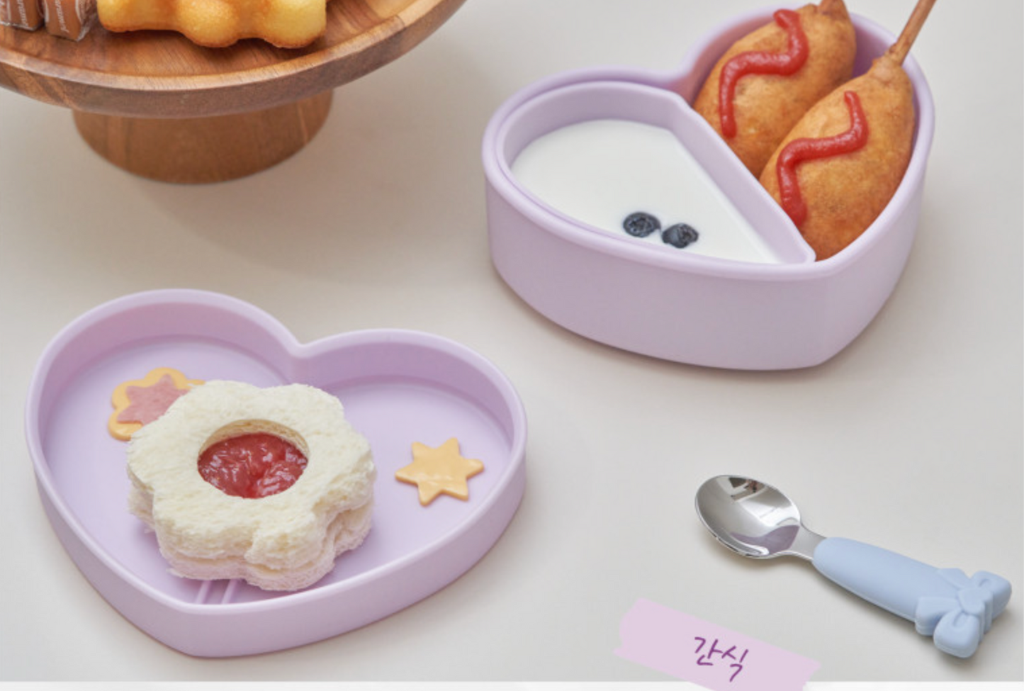 Healthy kids lunch displayed in a purple heart lunchbox