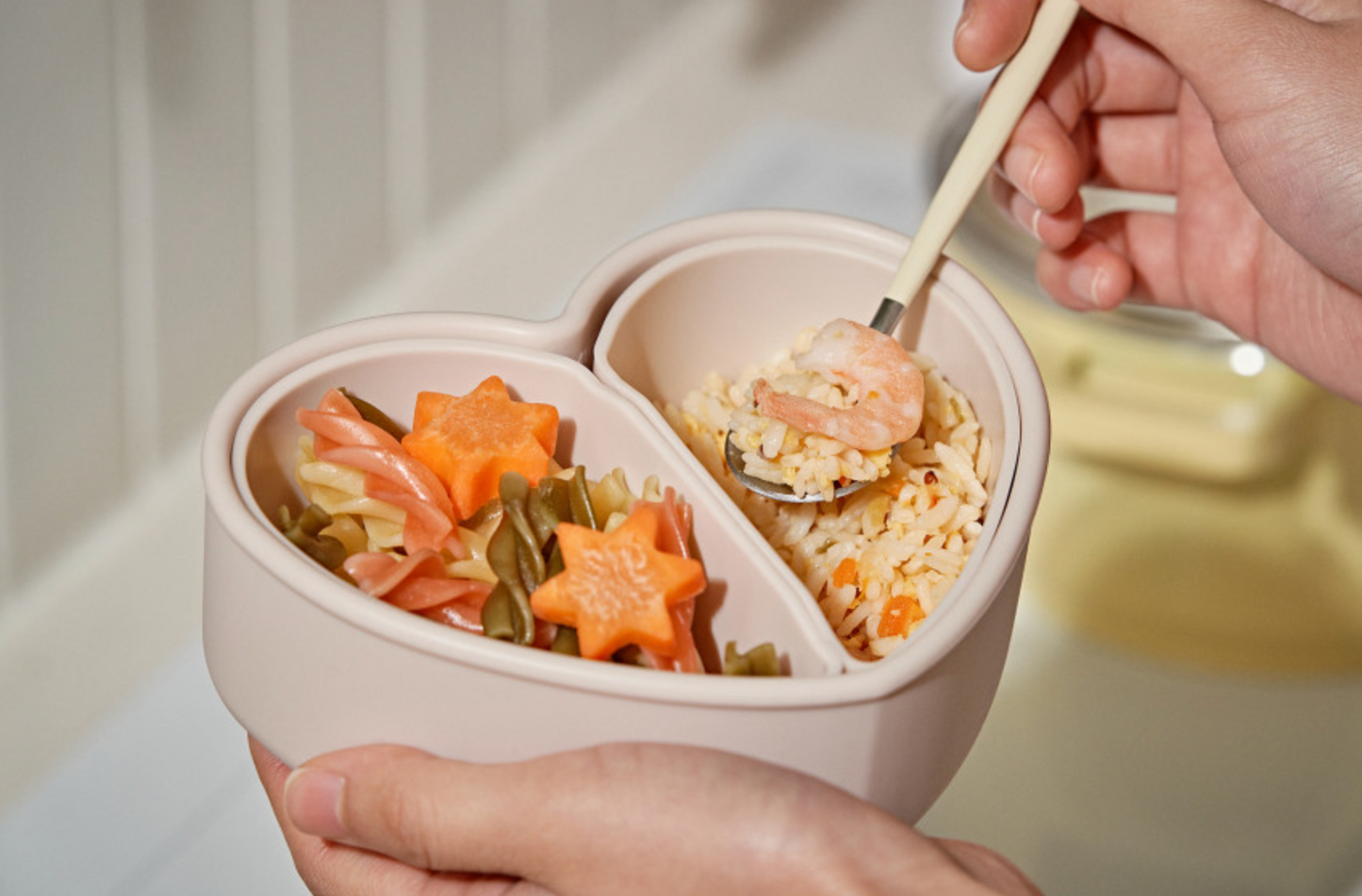 Colorful lunch packed in heart-shaped silicone bento box