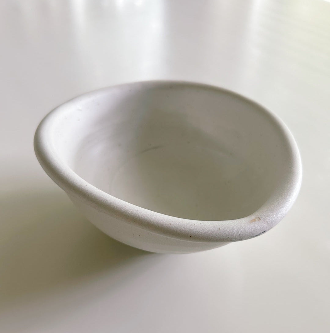 White ceramic bowl on a white background