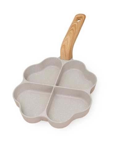 Four-sectioned pan with a wooden handle on a white background