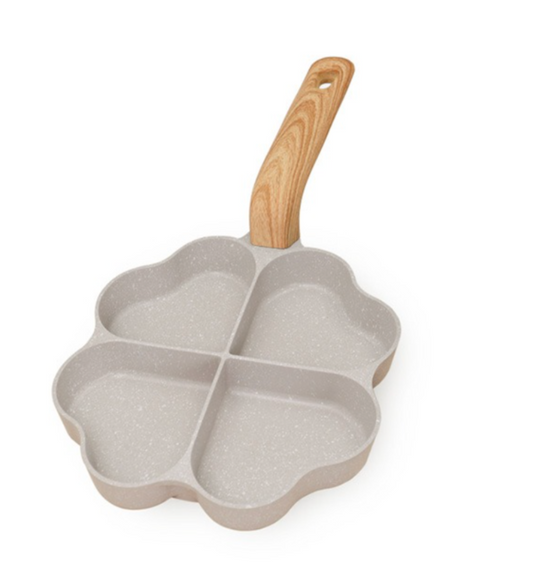 Four-sectioned pan with a wooden handle on a white background